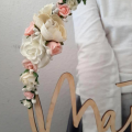 round decoration with flowers and kids name